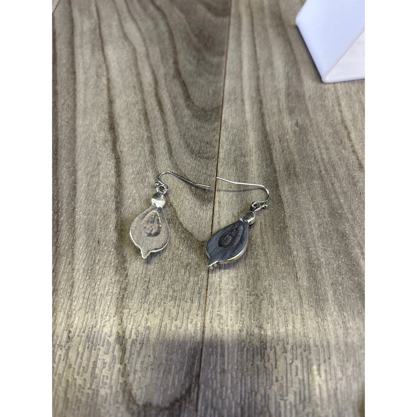 Purple stones on silver tear drop earrings