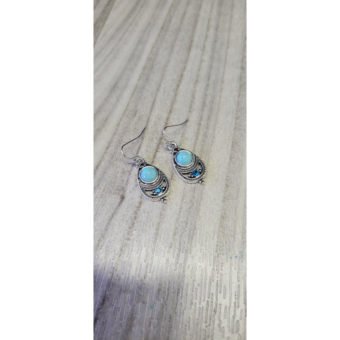 Sliver dangle earrings with blue stones