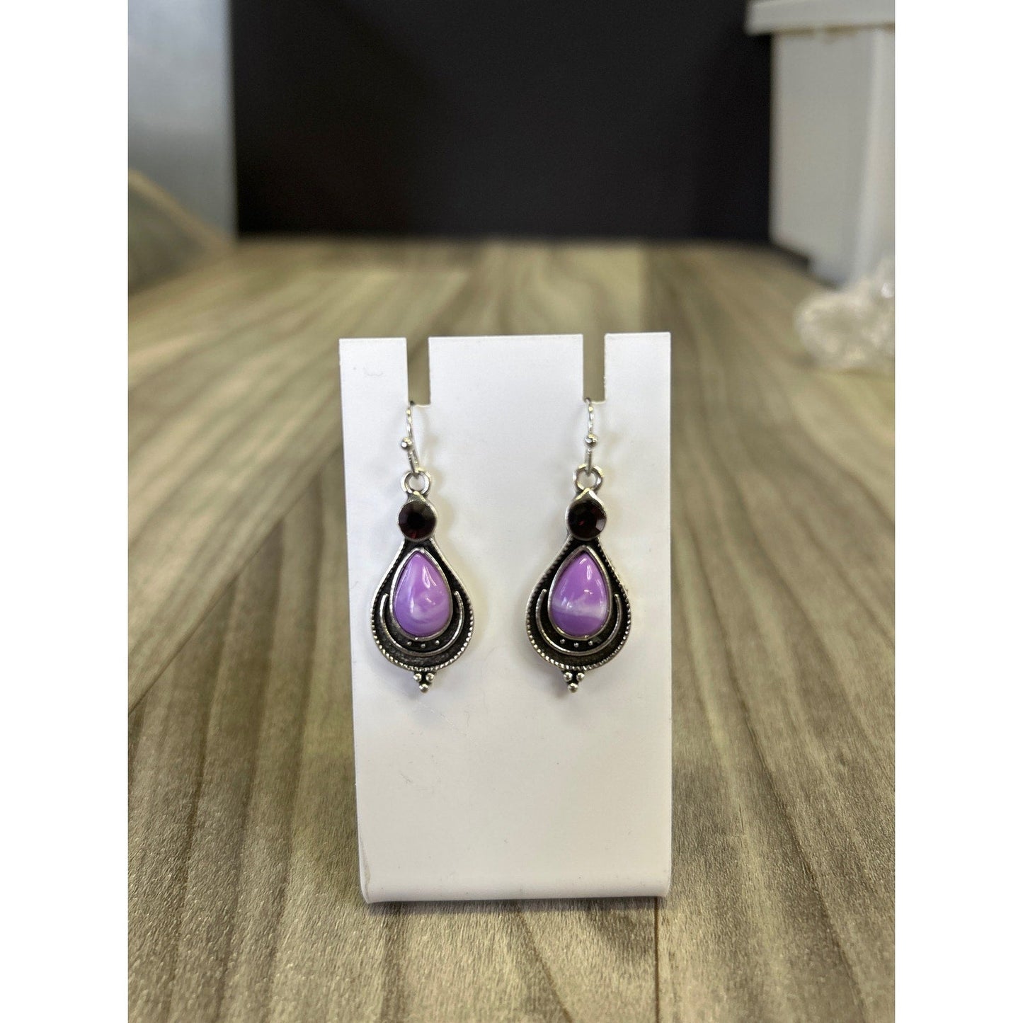 Purple stones on silver tear drop earrings