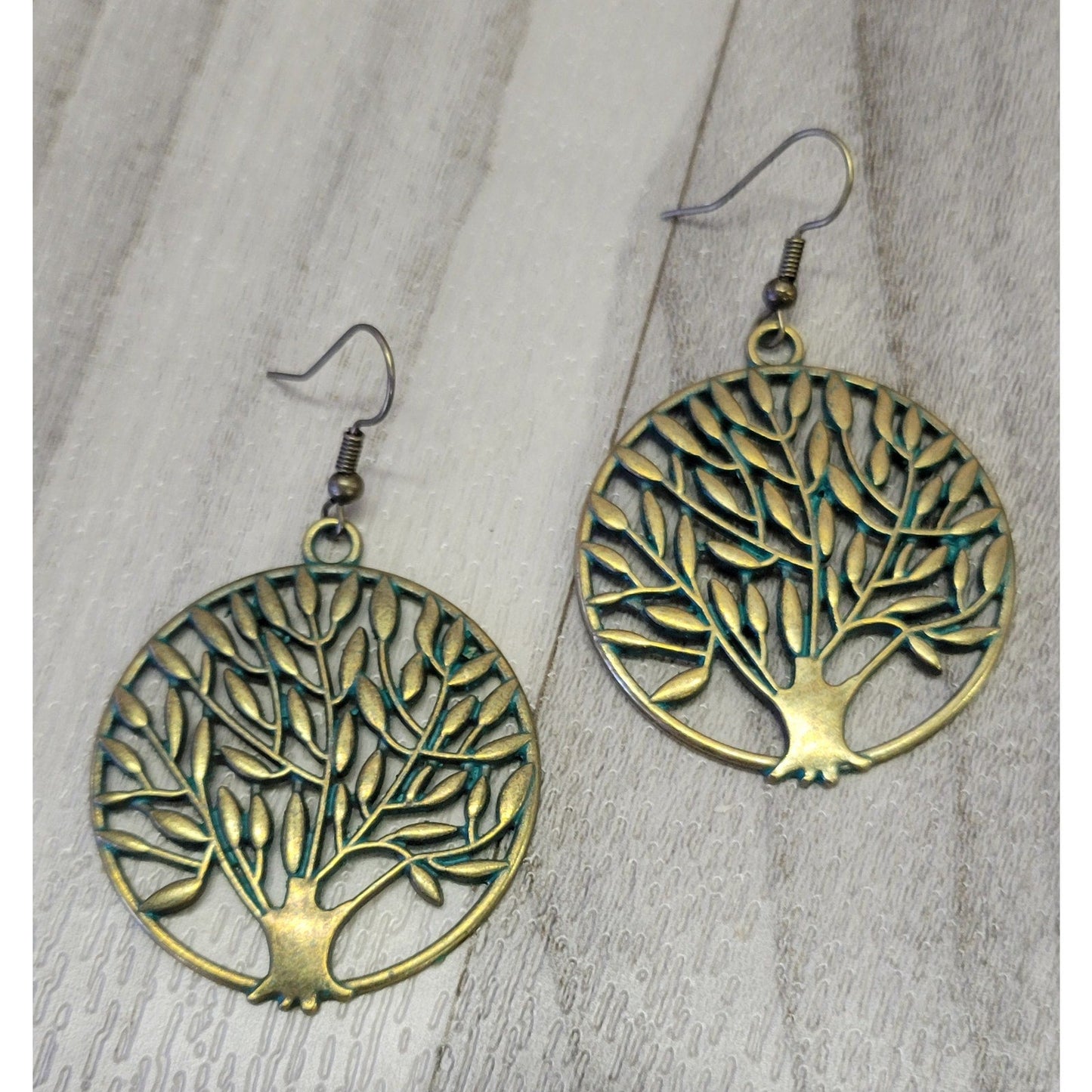 Gold tone tree of life earrings