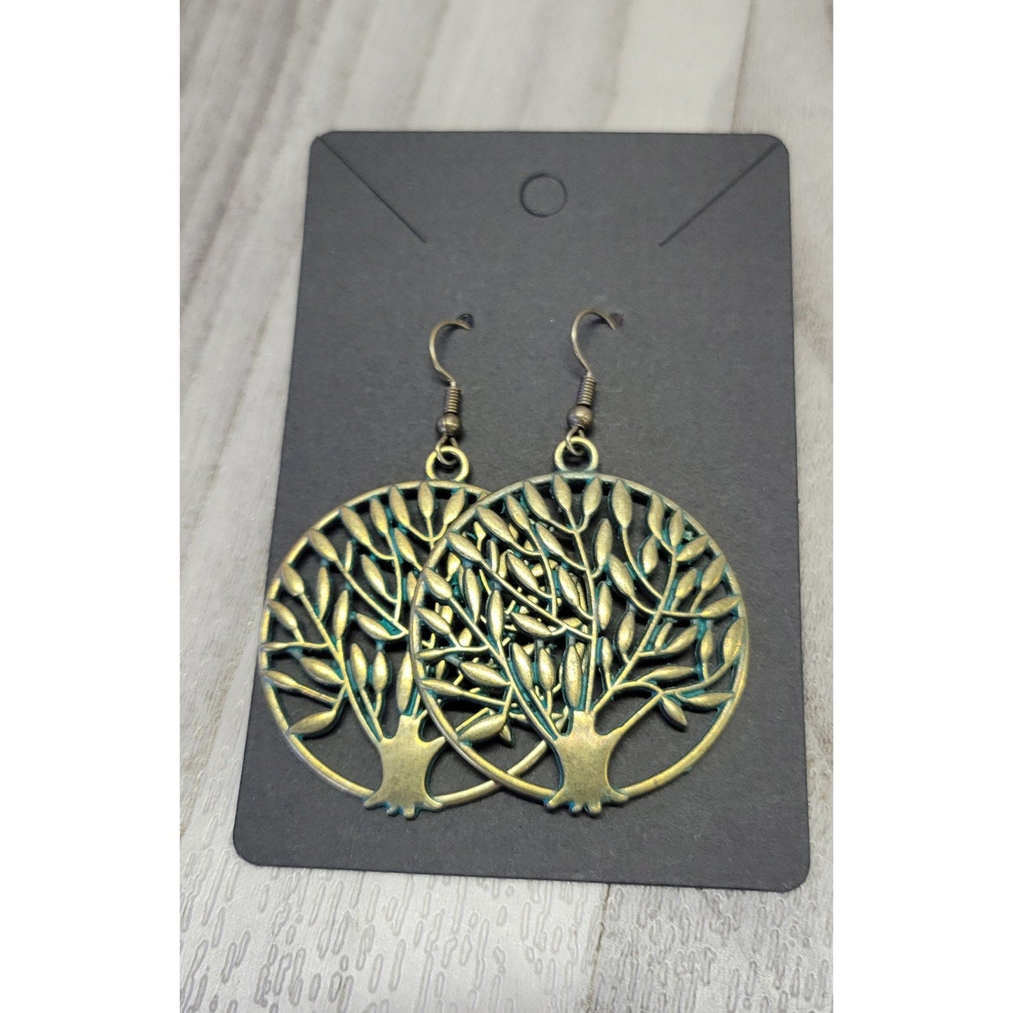 Gold tone tree of life earrings