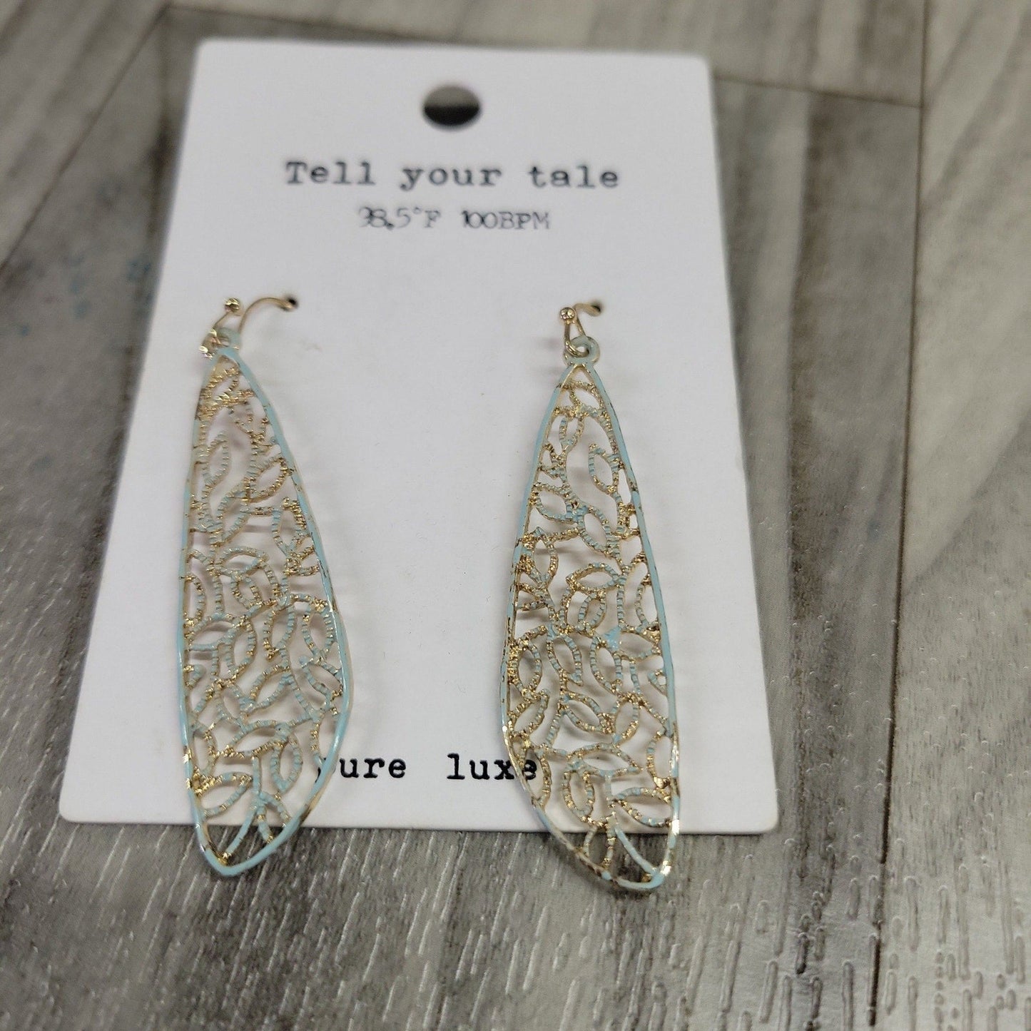gold and light blue tone earrings