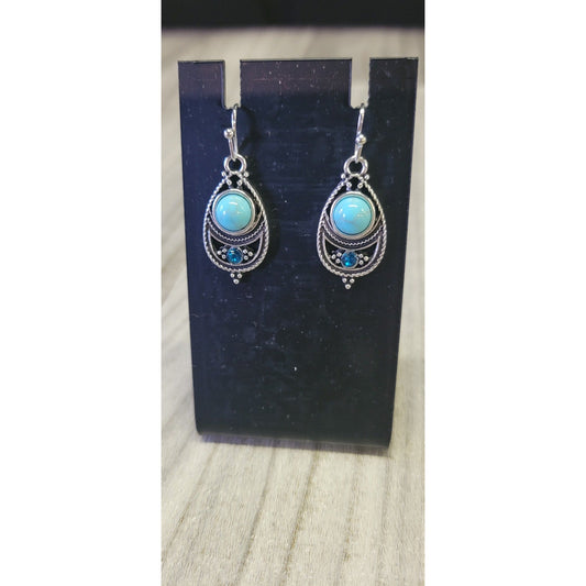 Sliver dangle earrings with blue stones
