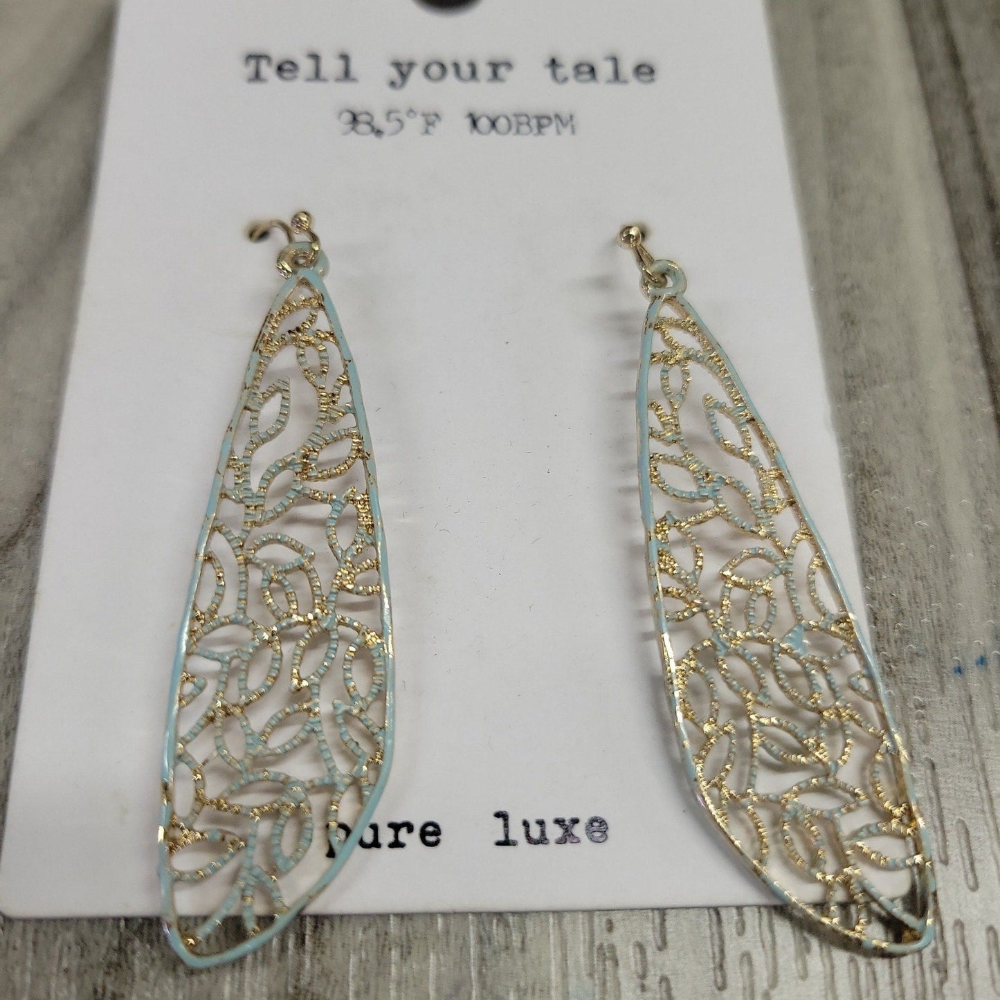 gold and light blue tone earrings
